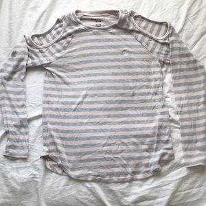 Long sleeve stripped shirt with cut out shoulder.